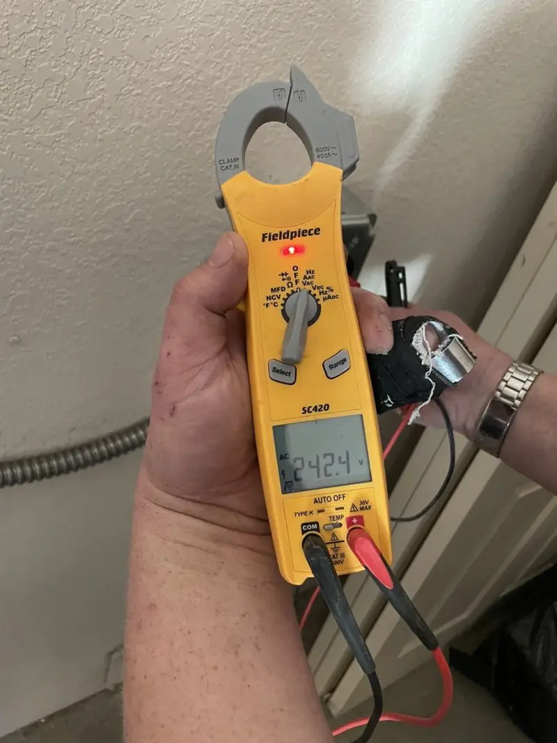Voltage testing with clamp meter during Recessed Lighting Installation in Coral Gables